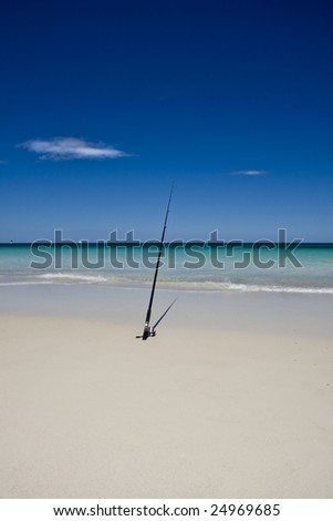 fishing rod on perfect beach