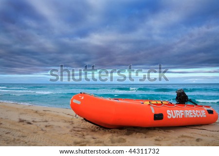 Surf Rescue boat against dramatic sky