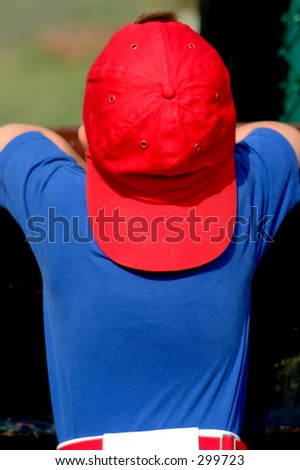 Little baseball player waiting for the game