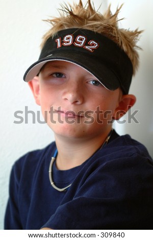stock photo Preteen boy with spiked blond hair