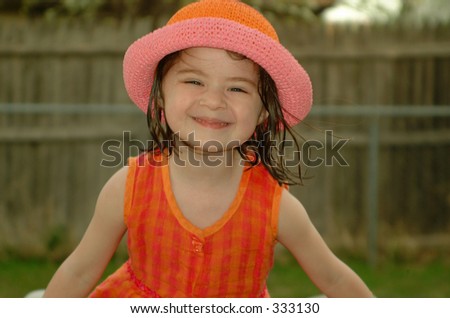 Little girl with a big silly smile.