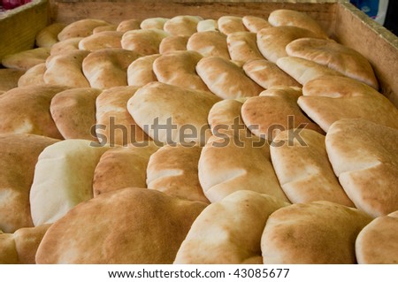pita bread on a huge tray for sale in the market