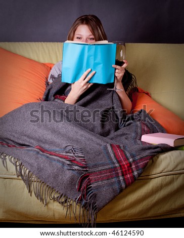 young woman reading a funny book