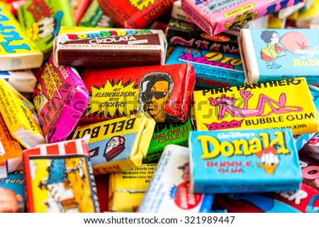 ASHDOD, ISRAEL - SEPTEMBER 27, 2015: Many various colorful chewing or bubble gum from seventies, eighties and nineties, including Robocop, Turbo, Donald Duck, BomBibom, TipiTip, X-Men, Dunkin