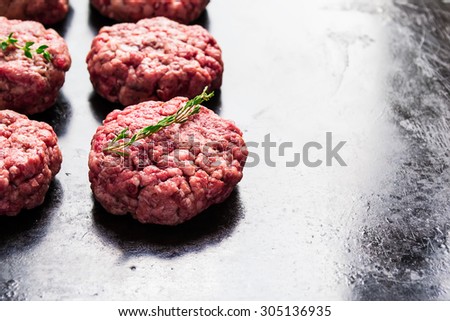 raw burgers from organic beef, selective focus, copy space backg
