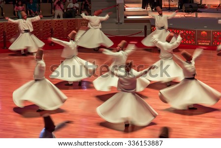 KONYA- JULY 25: Sufi whirling dervish (Semazen) dances at Mevlana Culture Center on July 25, 2015 in Konya. Semazen conveys God\'s spiritual gift to those are witnessing the ritual.