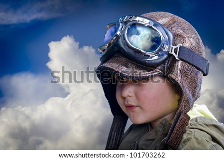 Child pilot, cute and funny over background clouds