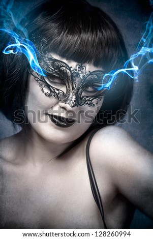 Mysterious brunette woman in lingerie, blue smoke coming out of the eyes