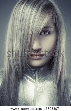 Serious young blond, concept future and modernity, girl with sweet face