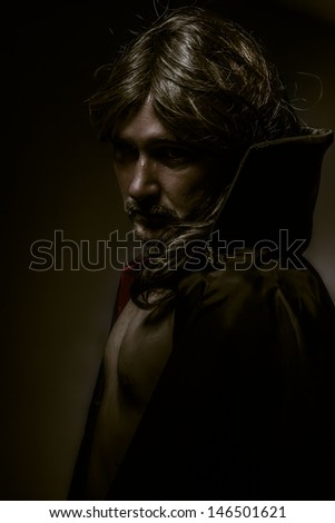 Vampire with red coat and long hair, nude
