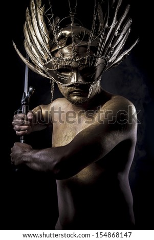 warrior or ancient god with golden mask and sword greatsword