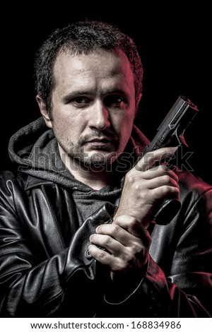 Housebreaker, thief, armed man with black leather jacket, dangerous
