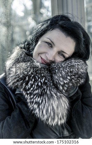 Luxury.Beautiful woman in winter.Beauty Fashion Model Girl in a Fur Hat. Russian Stylish young.Portrait.