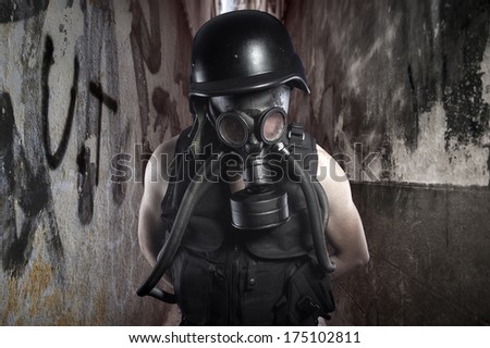 Survival.Environmental disaster. Post apocalyptic survivor in gas mask