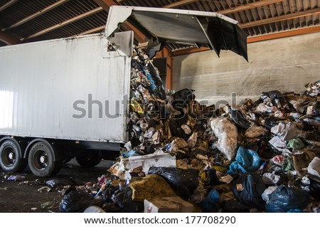 Recycle plant. truck unloading huge amounts of garbage, recycle plant in spain