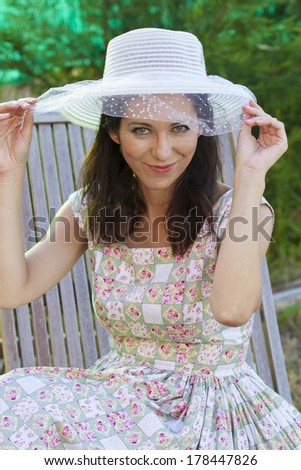 Woman gardening. Mature girl gardening in her backyard. spring season, rural scene