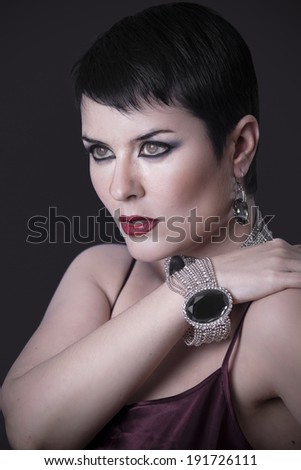 Sexy woman with elegant silver jewelry