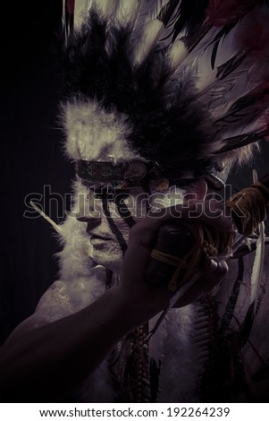 American Indian chief with big feather headdress, warrior