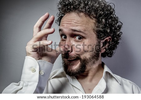 I do not want to hear anything, man with intense expression, white shirt