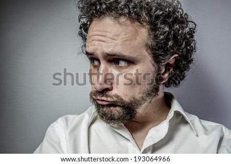 sad face, man with intense expression, white shirt