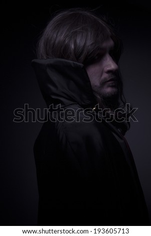 Goth, man with long hair and black coat