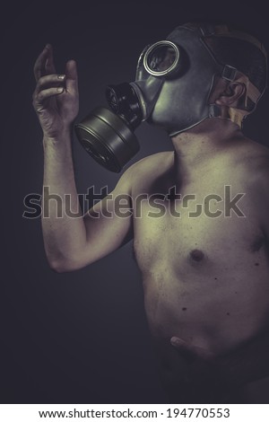 Nude man with gas mask, pollution concept protection