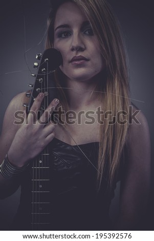 Star, Beautiful blonde with black electric guitar