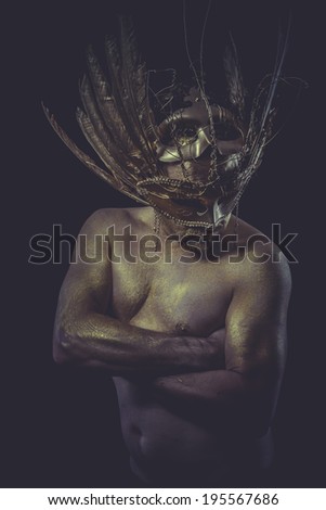 golden deity, man with wings and gold helmet