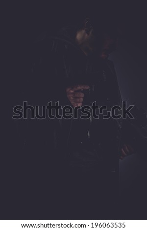 mafia, portrait of stylish man with long leather jacket, gun armed