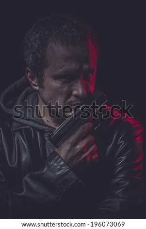 Gansgter Assassin, man with black coat and gun
