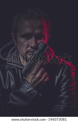 Violence Assassin, man with black coat and gun