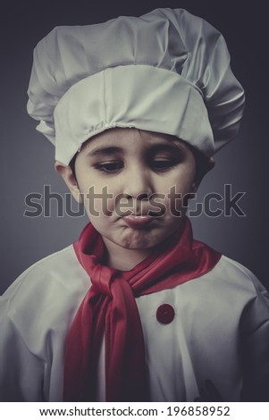 sad child dress funny chef, cooking utensils