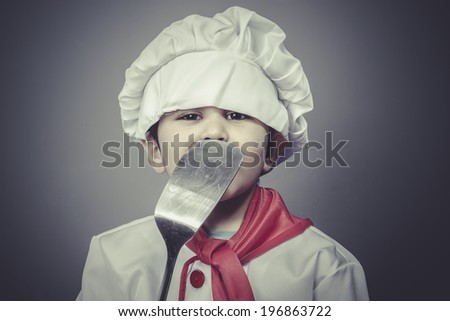preparing food , child dress funny chef, cooking utensils