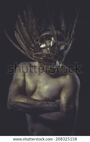 gold man, wings and golden helmet