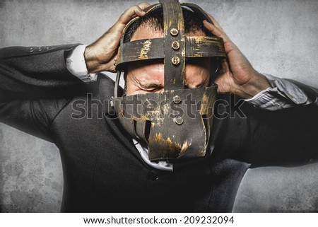 crazy, dangerous business man with iron mask and expressions