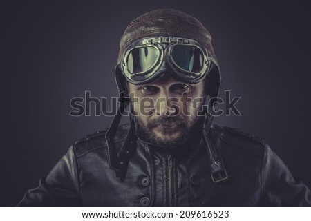 usaf pilot dressed in vintage style leather cap and goggles