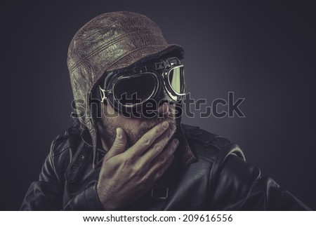 jacket, pilot dressed in vintage style leather cap and goggles