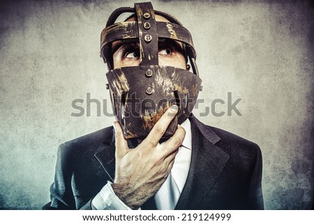 thinking, dangerous business man with iron mask and expressions