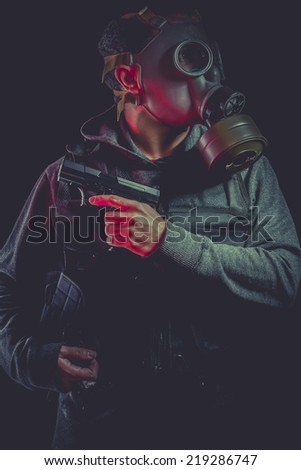 Man with gas mask and gun