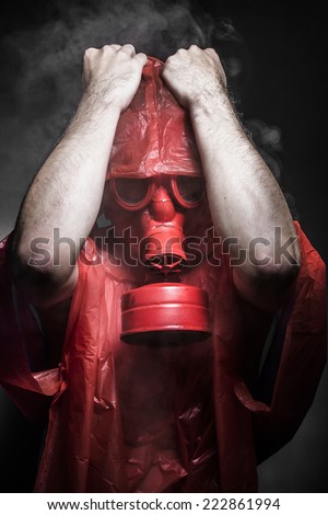 Factory, A man in a gas mask over  the smoke. black background and red colors
