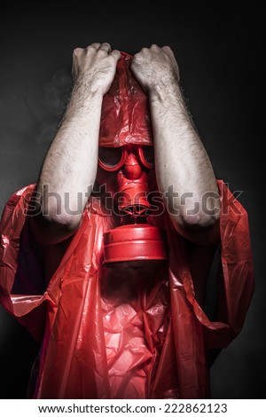 accident nuclear concept, man with red gas mask