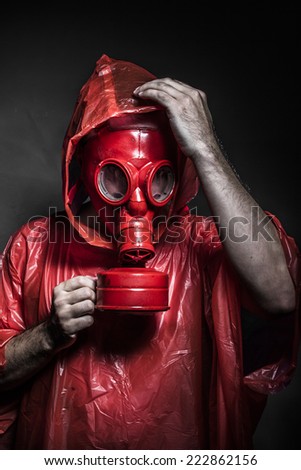 survival nuclear concept, man with red gas mask