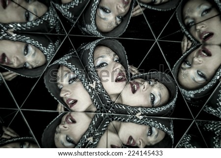 Beauty portrait, woman with helmet in a kaleidoscope of mirrors
