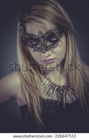 Gold metal, Beautiful blonde with silver jewelry and mask