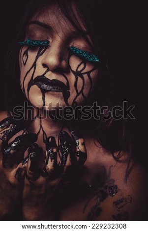 depression concept, crying woman with tears and makeup dark light