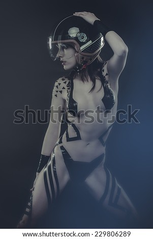 travel, beautiful woman with bike helmet, naked and black strips