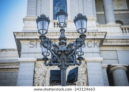 Old street lamp, Almudena Cathedral, located in the area of the Habsburgs, classical architecture