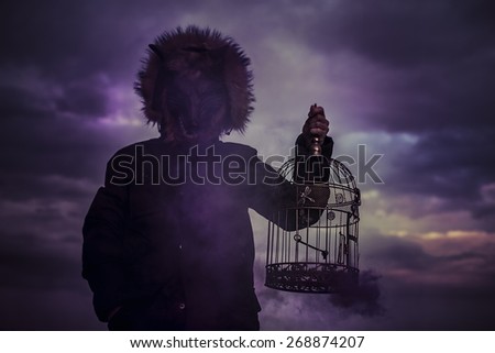 man with mask wolf cage at sunset, dreams and nightmares