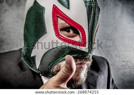 angry businessman  with Mexican wrestler mask