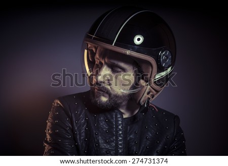 Trip, biker with motorcycle helmet and black leather jacket, metal studs